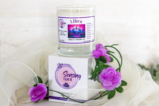 Libra candle and packaging with purple flowers on a white background