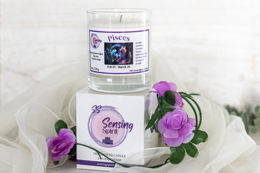 Candle with 'Pisces' label and packaging on a white background